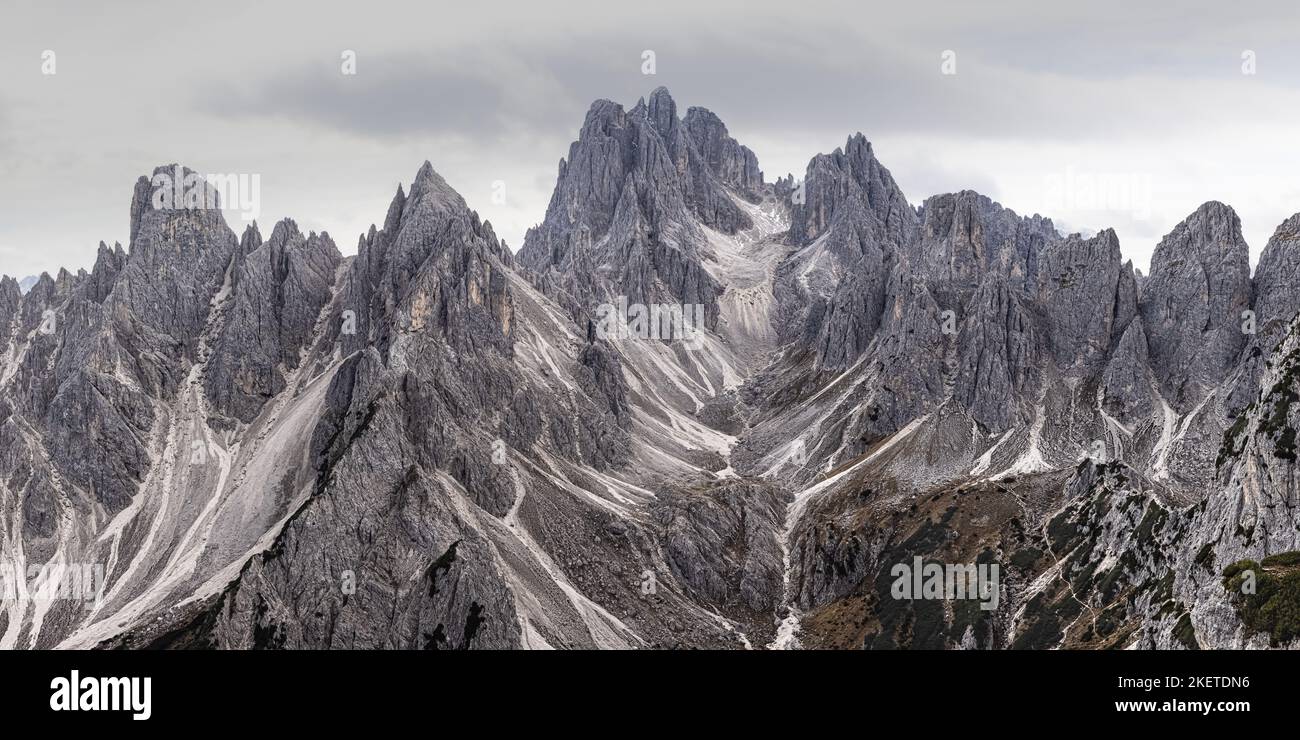 A 2:1 panoramic image from Cadini di Misurina. The peaks of Cadini di Misurina feel like they almost create an amphitheater in this spot in the Tre Ci Stock Photo