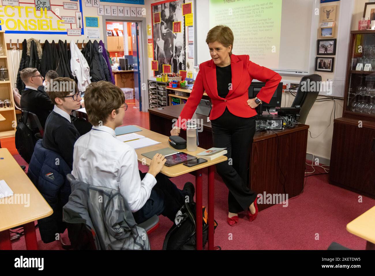 First Minister Nicola Sturgeon talking to pupils in a Modern Studies class during her visit to Whitehill Secondary School, Glasgow, to roll out the Scottish Child Payment. Picture date: Monday November 14, 2022. Stock Photo