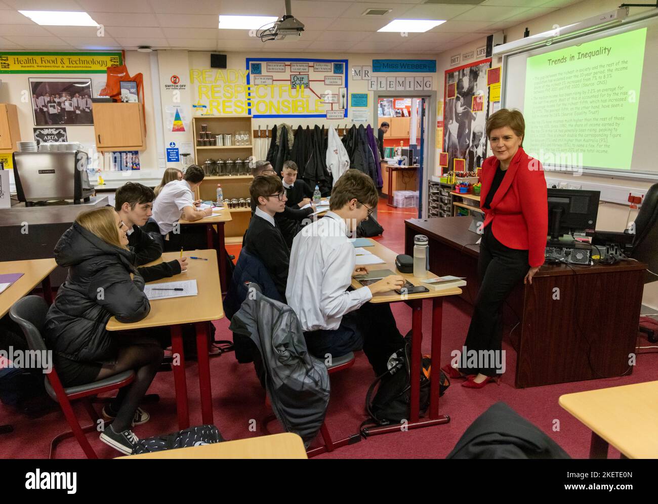 First Minister Nicola Sturgeon talking to pupils in a Modern Studies class during her visit to Whitehill Secondary School, Glasgow, to roll out the Scottish Child Payment. Picture date: Monday November 14, 2022. Stock Photo