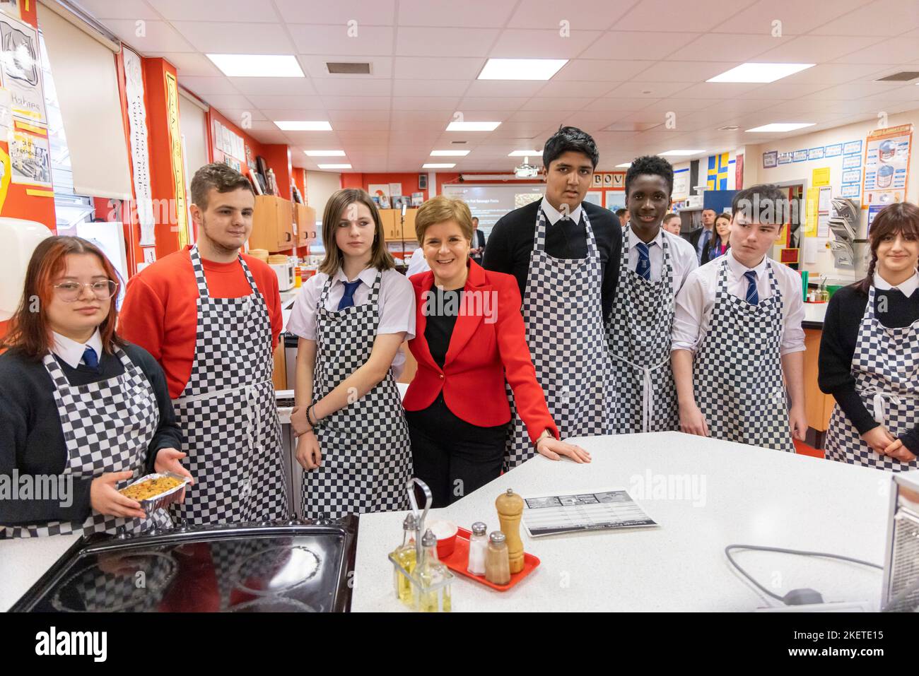 First Minister Nicola Sturgeon with pupils in a Home Economics class during her visit to Whitehill Secondary School, Glasgow, to roll out the Scottish Child Payment. Picture date: Monday November 14, 2022. Stock Photo