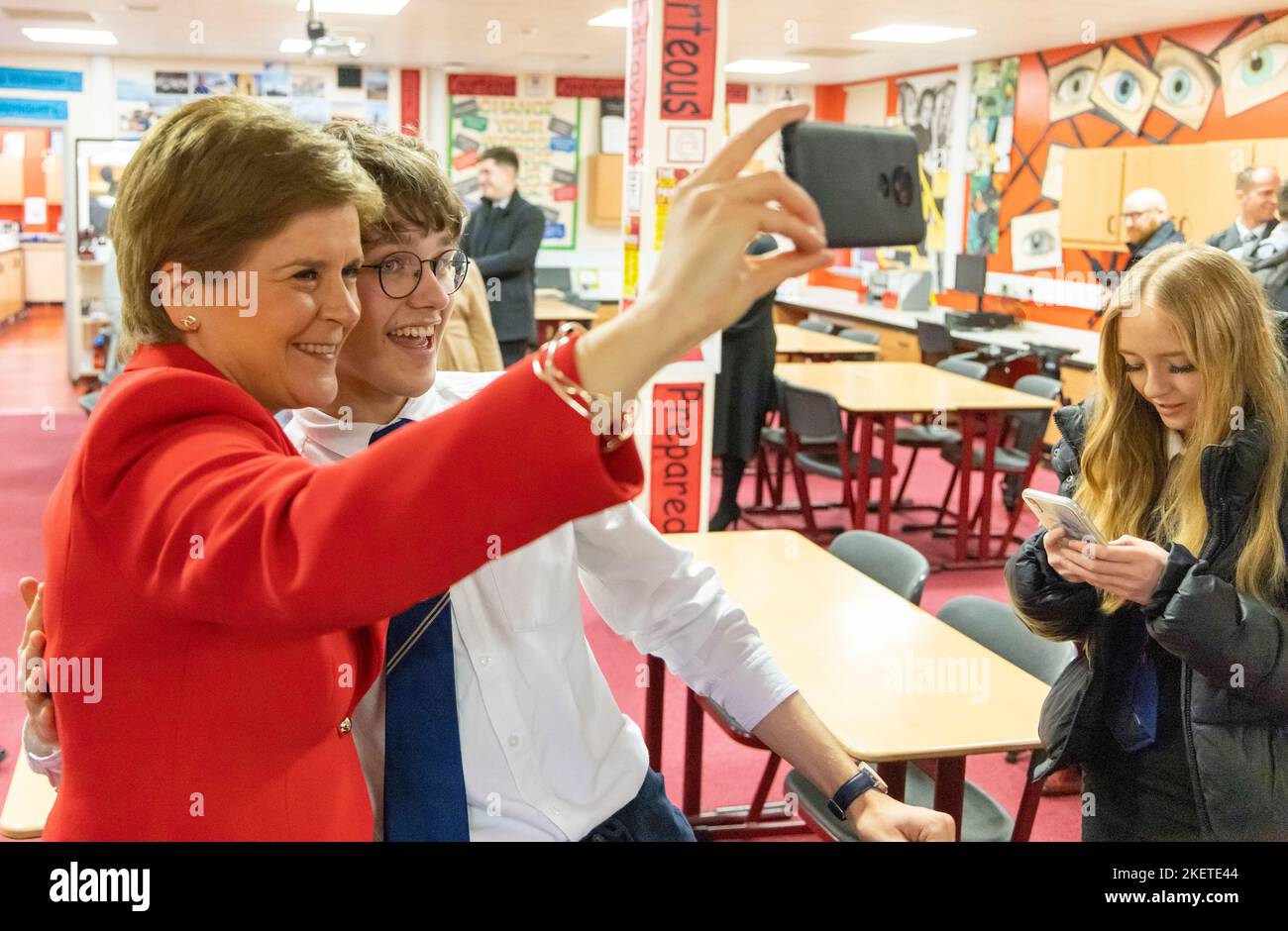 First Minister Nicola Sturgeon having a selfie with pupils in a Modern Studies class during her visit to Whitehill Secondary School, Glasgow, to roll out the Scottish Child Payment. Picture date: Monday November 14, 2022. Stock Photo