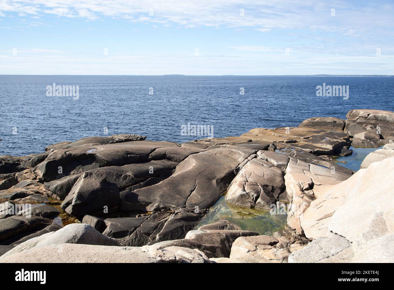 The eroded rocky shore in Peggy's Cove little village in Nova Scotia