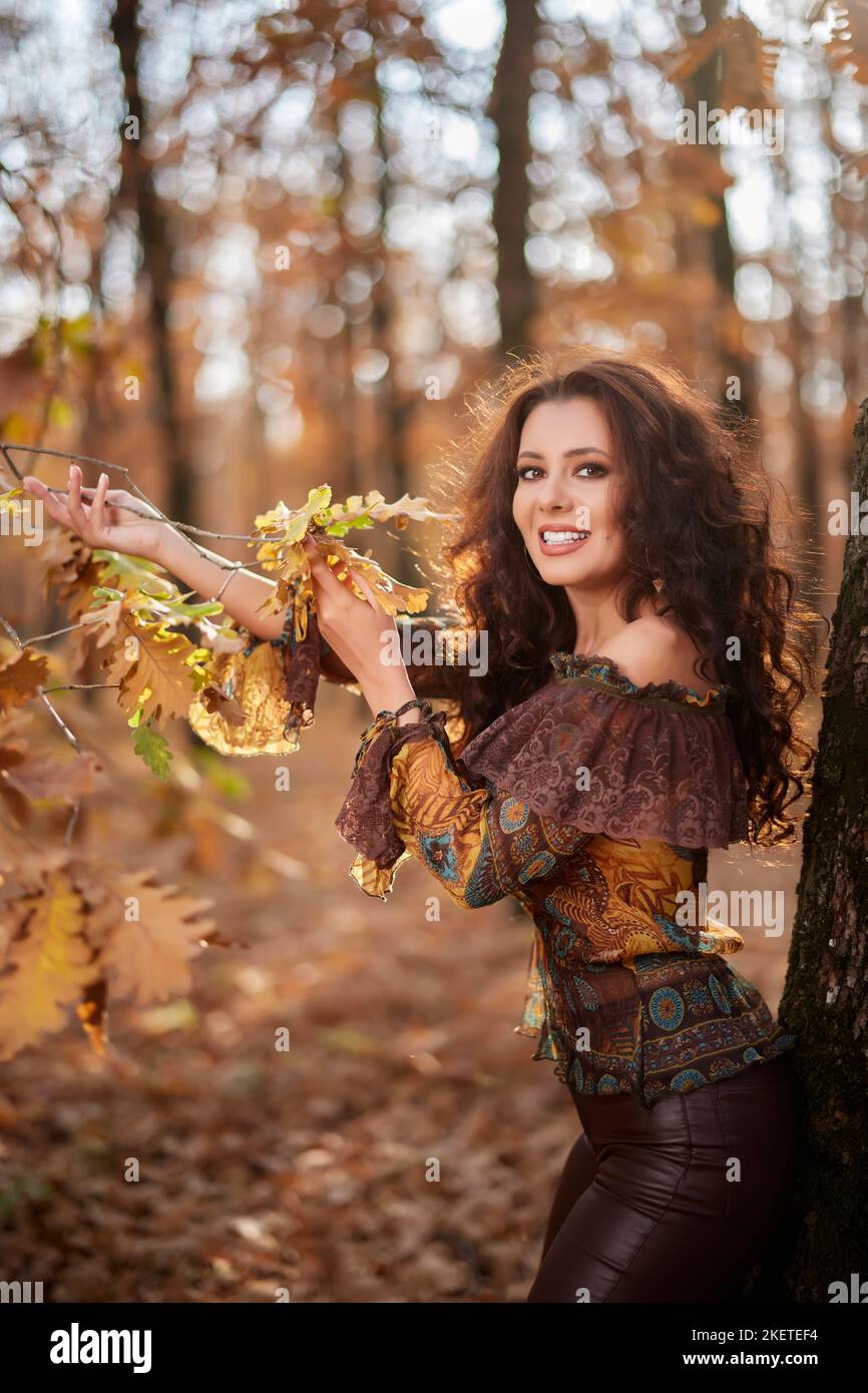 Portrait of a beautiful woman in the forest on a sunny autumn day Stock ...