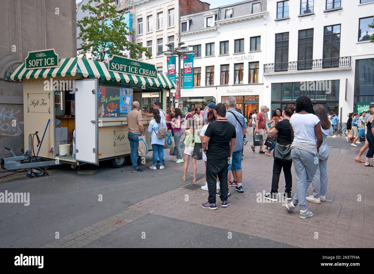 People in line at mobile kiosk selling ice cream, Antwerp (Flanders), Belgium Stock Photo
