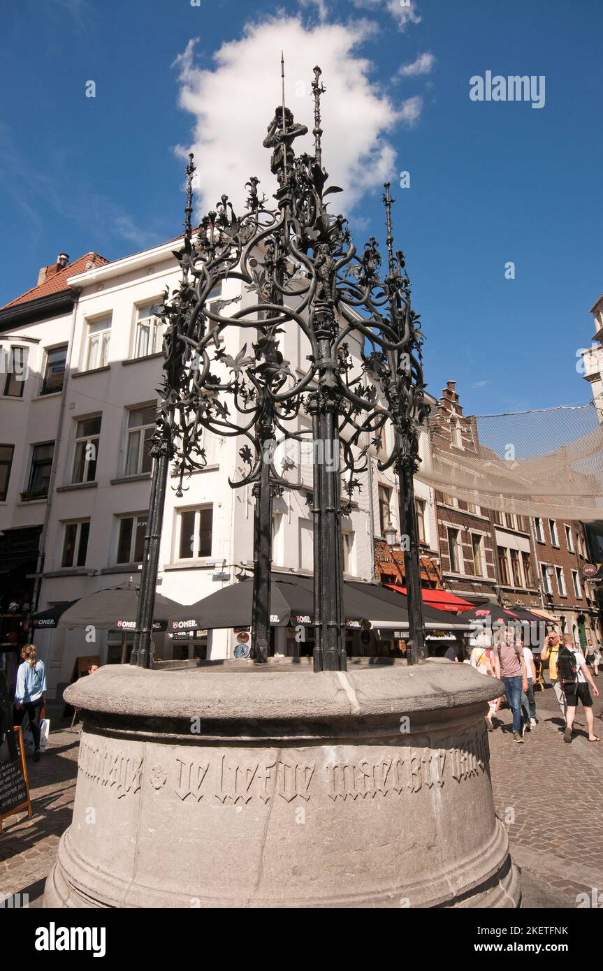 Medieval well decorated with wrought iron by Quentin Matsys (on the top is the statuette of mythical soldier Silvius Brabo), Antwerp, Flanders,Belgium Stock Photo