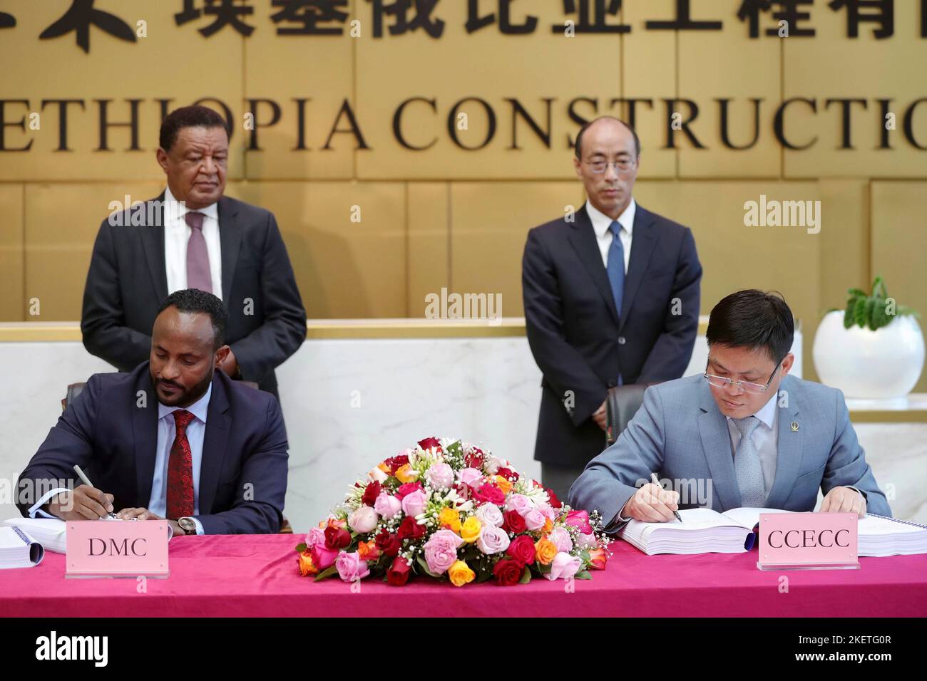 Addis Ababa, Ethiopia. 12th Nov, 2022. Representatives of China Civil Engineering Construction Corporation (CCECC) and DMC Trading Private Limited Company sign an agreement in Addis Ababa, Ethiopia, Nov. 12, 2022. Chinese construction giant CCECC on Saturday signed an agreement with an Ethiopian company to build a business complex in Addis Ababa, the capital of Ethiopia. TO GO WITH 'Chinese company to build business complex in Ethiopian capital' Credit: Wang Ping/Xinhua/Alamy Live News Stock Photo