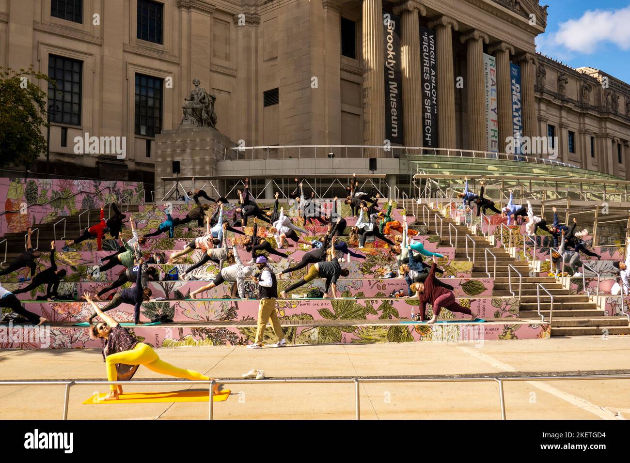 yoga class in outside on the step to the Brooklyn Museum of Art in