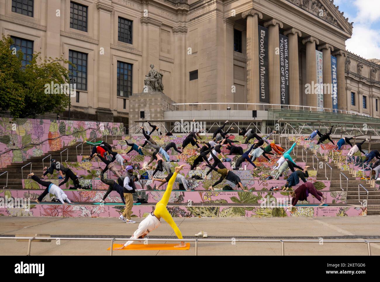 yoga class in outside on the step to the Brooklyn Museum of Art in ...