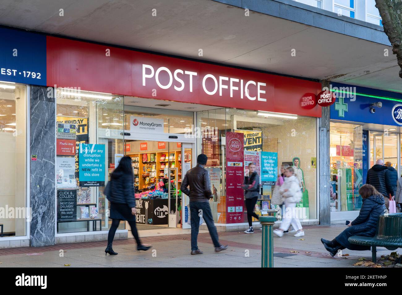 Shoppers walking past a Post Office franchise branch run out of a WHSmith store on Mell Square