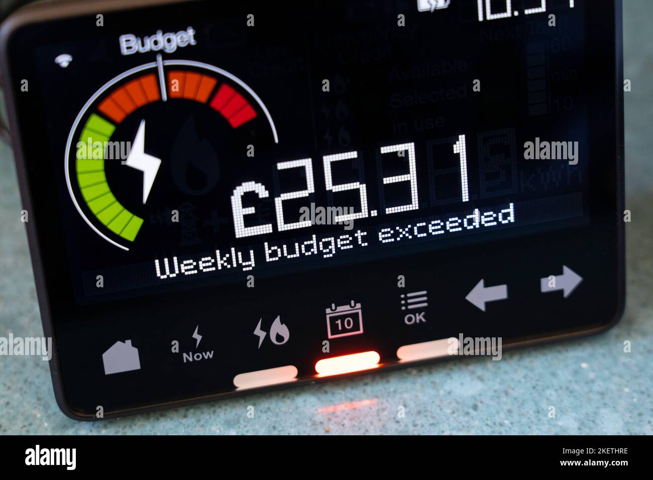 Smart energy meter showing electricity usage & that the weekly budget has been exceeded. Theme: cost of living, rising energy bills, living standards Stock Photo