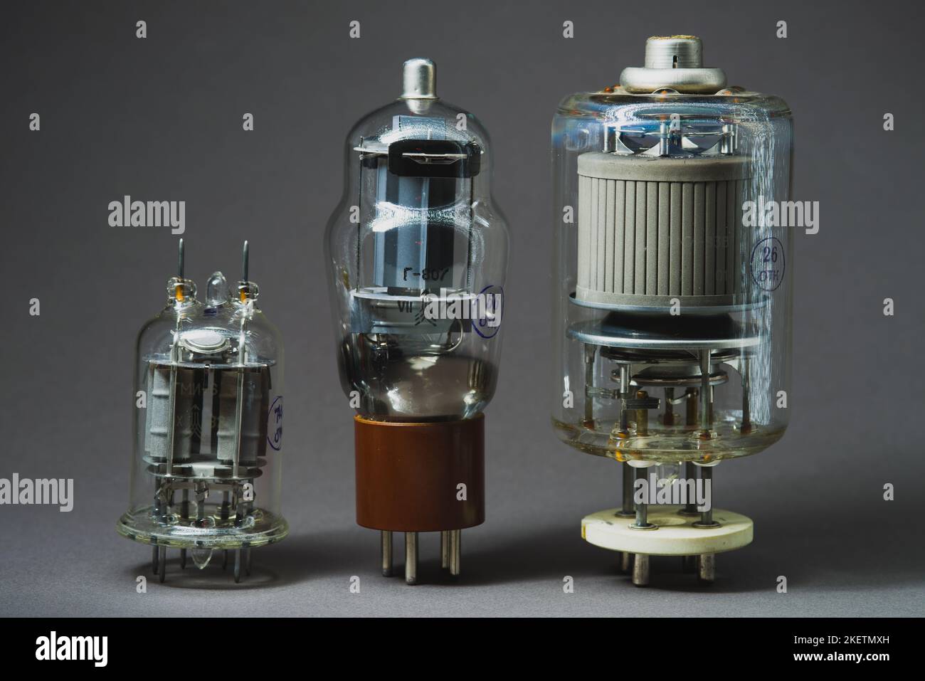 Old vacuum tube on gray background Stock Photo