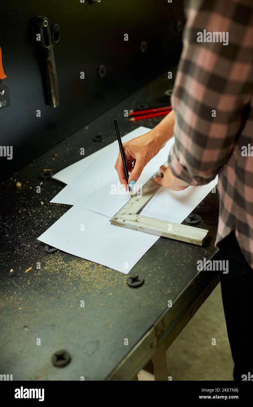 Female interior designer working on drawings, woman architect draws ...