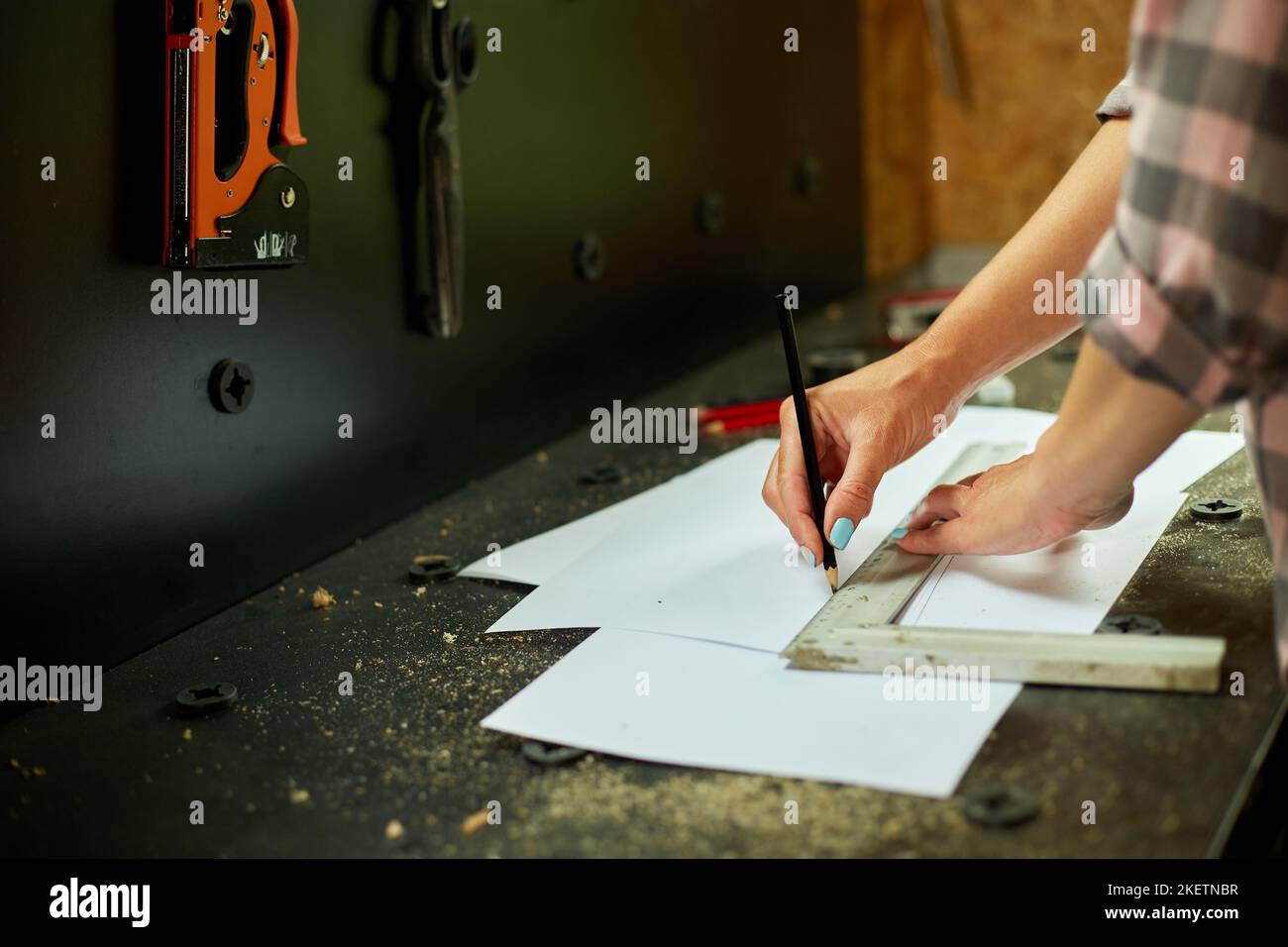 Female interior designer working on drawings, woman architect draws ...