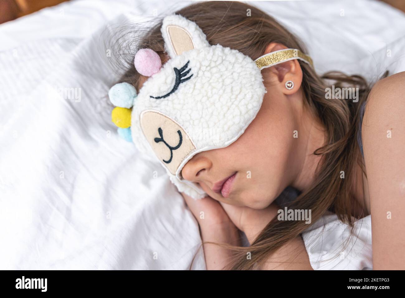 Little girl wearing sleeping mask hi-res stock photography and images ...