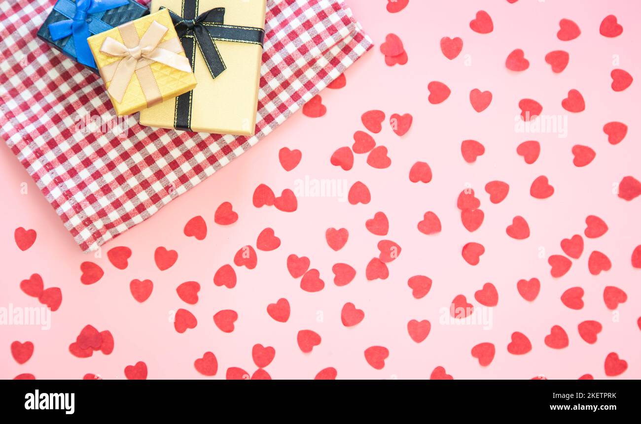 Gift boxes and pink background with small hearts, flat lay Stock Photo ...