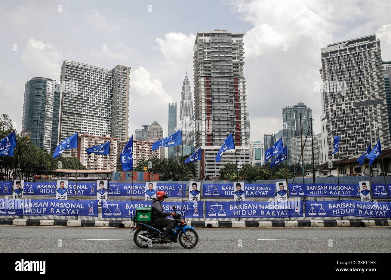 Kuala Lumpur, Malaysia. 14th Nov, 2022. A food delivery rider rides ...