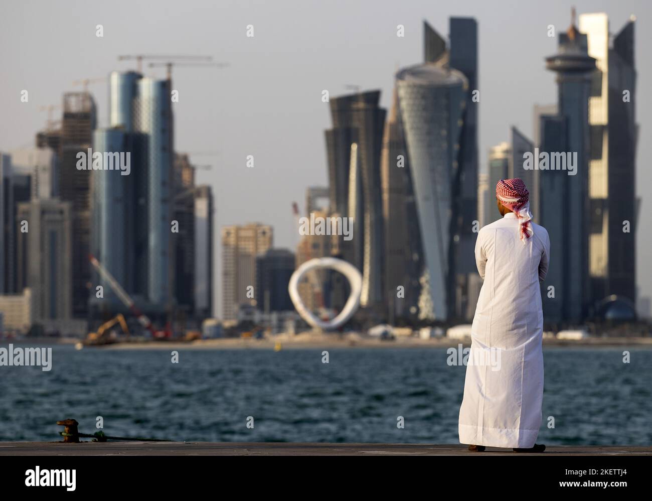 DOHA - Qatar, 2022-11-14 14:02:07 DOHA - A Qatari with West Bay in Doha in the background. Qatar is awaiting the FIFA World Cup. ANP KOEN VAN WEEL netherlands out - belgium out Stock Photo