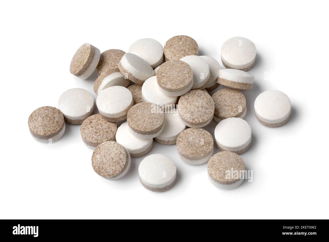 Heap of Dutch black and white liquorice pastilles close up isolated on white background Stock Photo