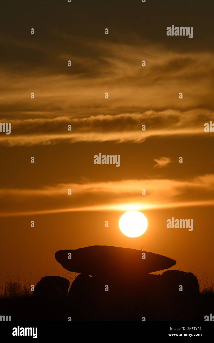 Drosa, Germany. 14th Nov, 2022. The sun sets behind the Drosa megalithic tomb. The grave, called 'Devil's Cellar', is said to date from the Neolithic period, which lasted from 4500 to 2000 BC, according to an information board. The weather is supposed to change during the week. It will become more unstable and the sun will rarely appear. Credit: Klaus-Dietmar Gabbert/dpa/Alamy Live News Stock Photo