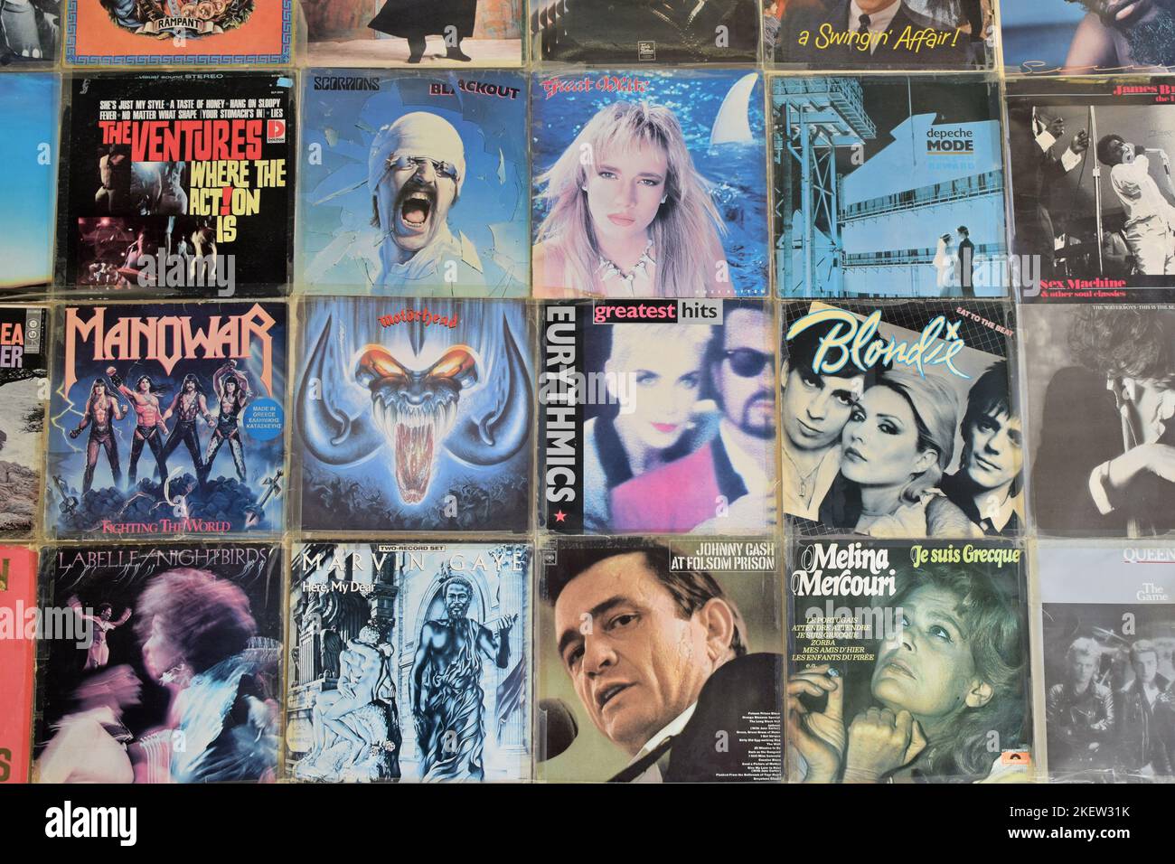 Athens, Greece - April 1, 2018: Vintage pop rock music vinyl album covers on record store wall. Stock Photo