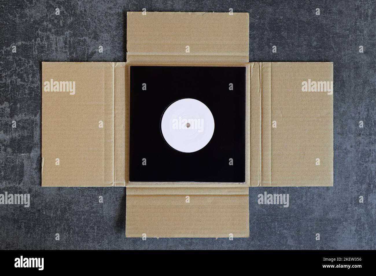 Vinyl record single packed in cardboard mailer shipping box Stock Photo