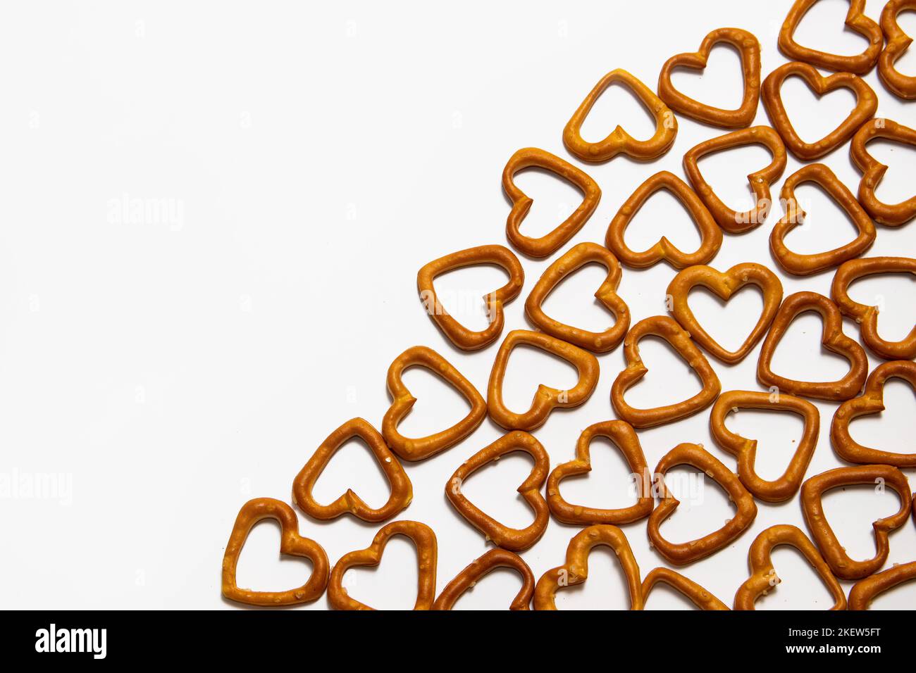 Heartshaped salty pretzels on white background Stock Photo Alamy