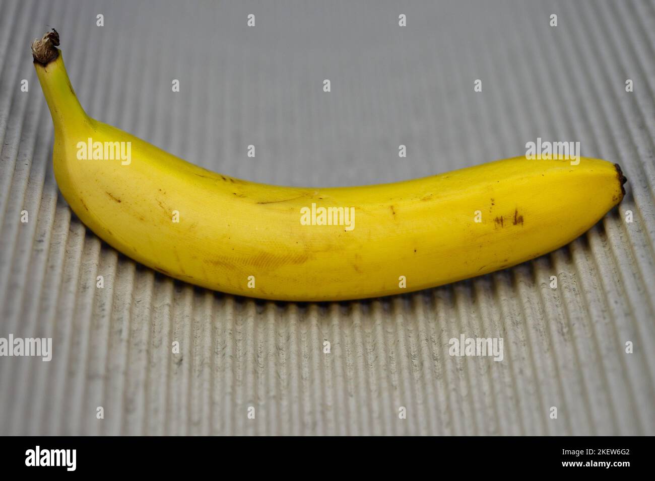 Wavy lines and banana. Stock Photo