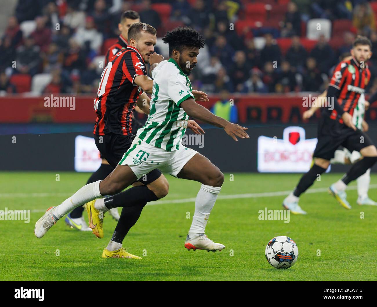 Petrus Boumal of Ujpest FC competes for the ball with Jose Marcos