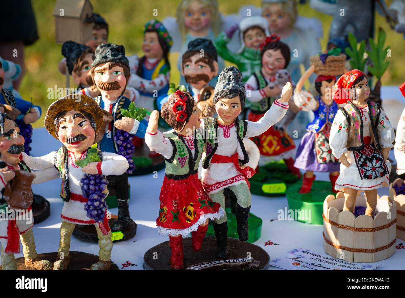 Assortment of clay Souvenirs. Clay souvenir figurines of mans and ...
