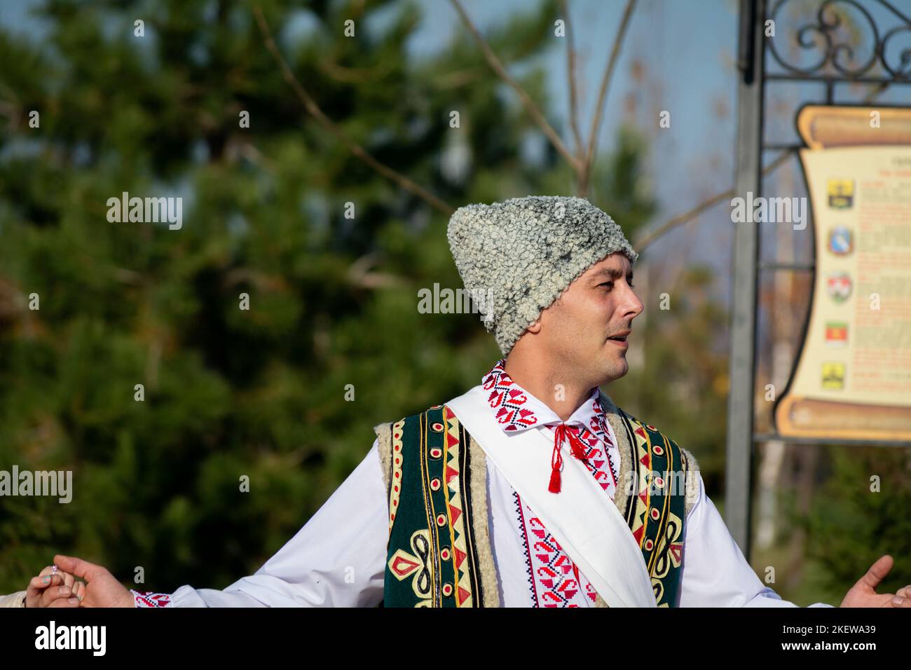 Bendery, Moldova - November 12, 2022: Man of European appearance in a national Mordovian costume dances traditional Chora dance during the Wine Day. s Stock Photo