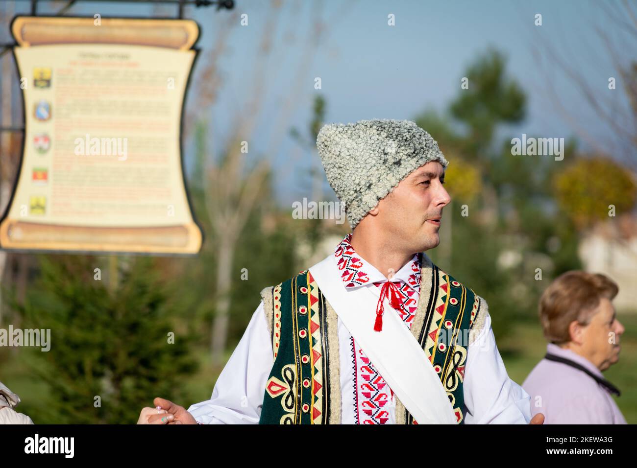 Bendery, Moldova - November 12, 2022: Man of European appearance in a national Mordovian costume dances traditional Chora dance during the Wine Day. s Stock Photo