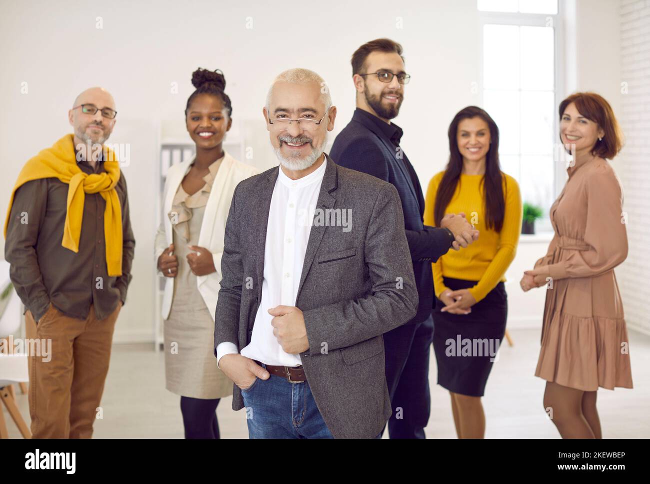 Multiracial business team with senior boss forefront Stock Photo
