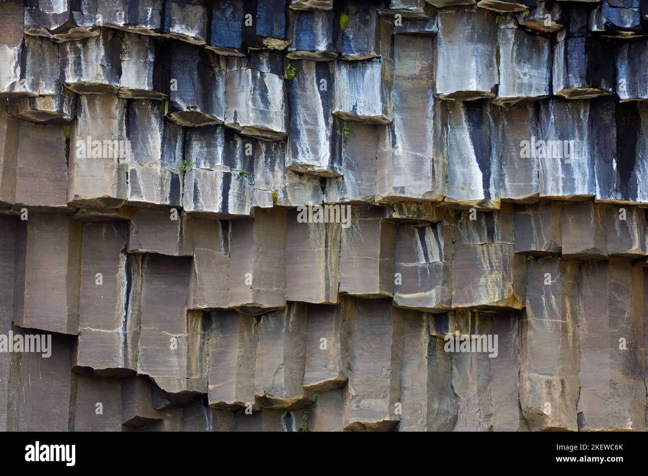 Hexagonal basalt columns / rock formations near Svartifoss, waterfall in Skaftafell in the Vatnajökull National Park, Austurland, Iceland Stock Photo