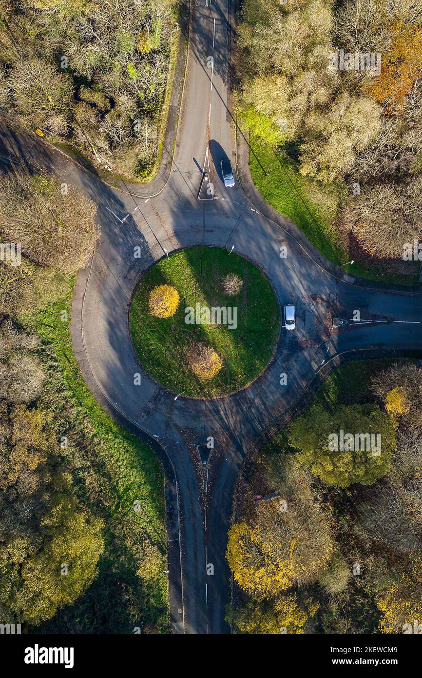 Aerial view of a traffic roundabout surrounded by autumn trees (Wales, UK) Stock Photo