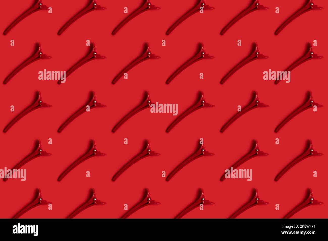 Red hair clip on red pattern Stock Photo