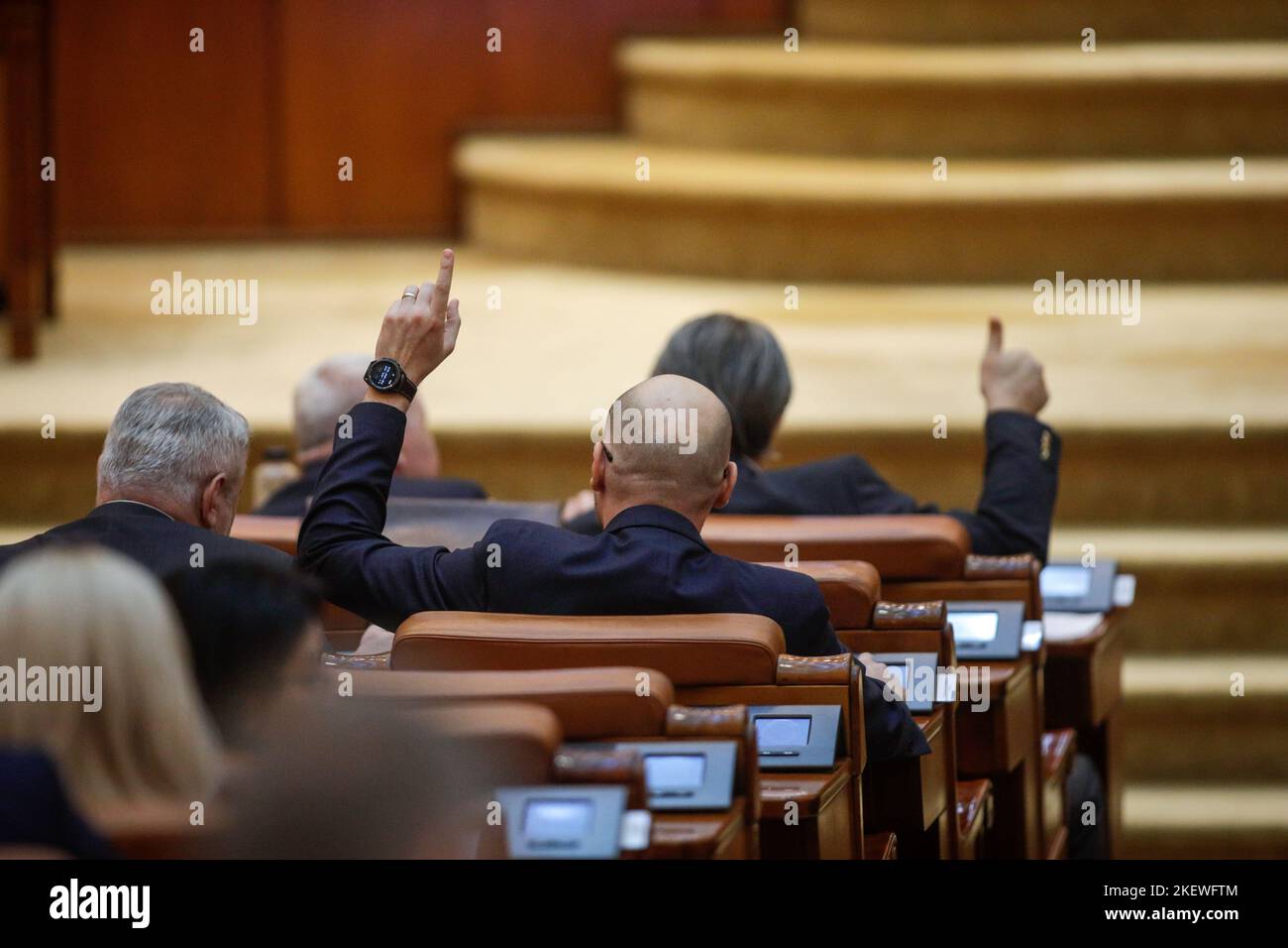Bucharest, Romania - November 14, 2022:  Romanian member of parliament gestures to his colleagues how to vote on bills. Stock Photo