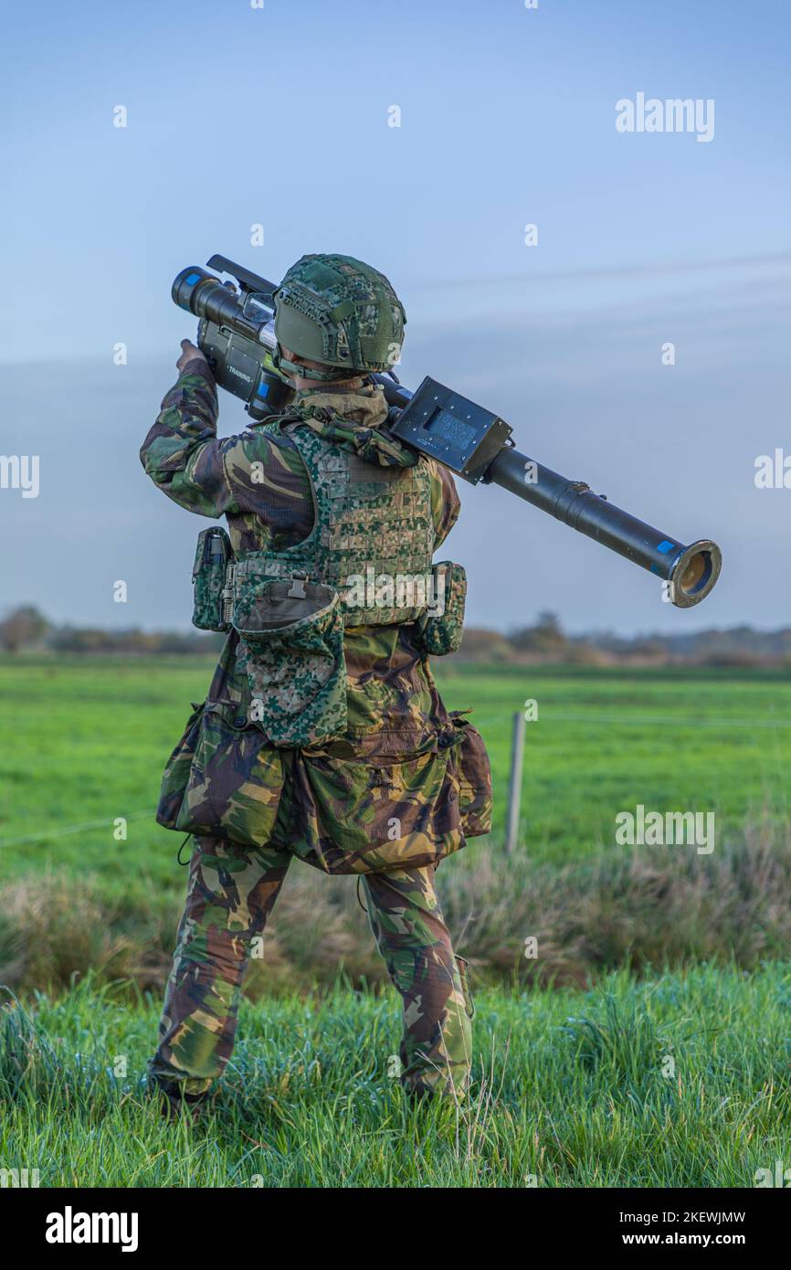 Air defense soldier wit Manpads stinger aiming at a low flying aircraft or helicopter Stock Photo