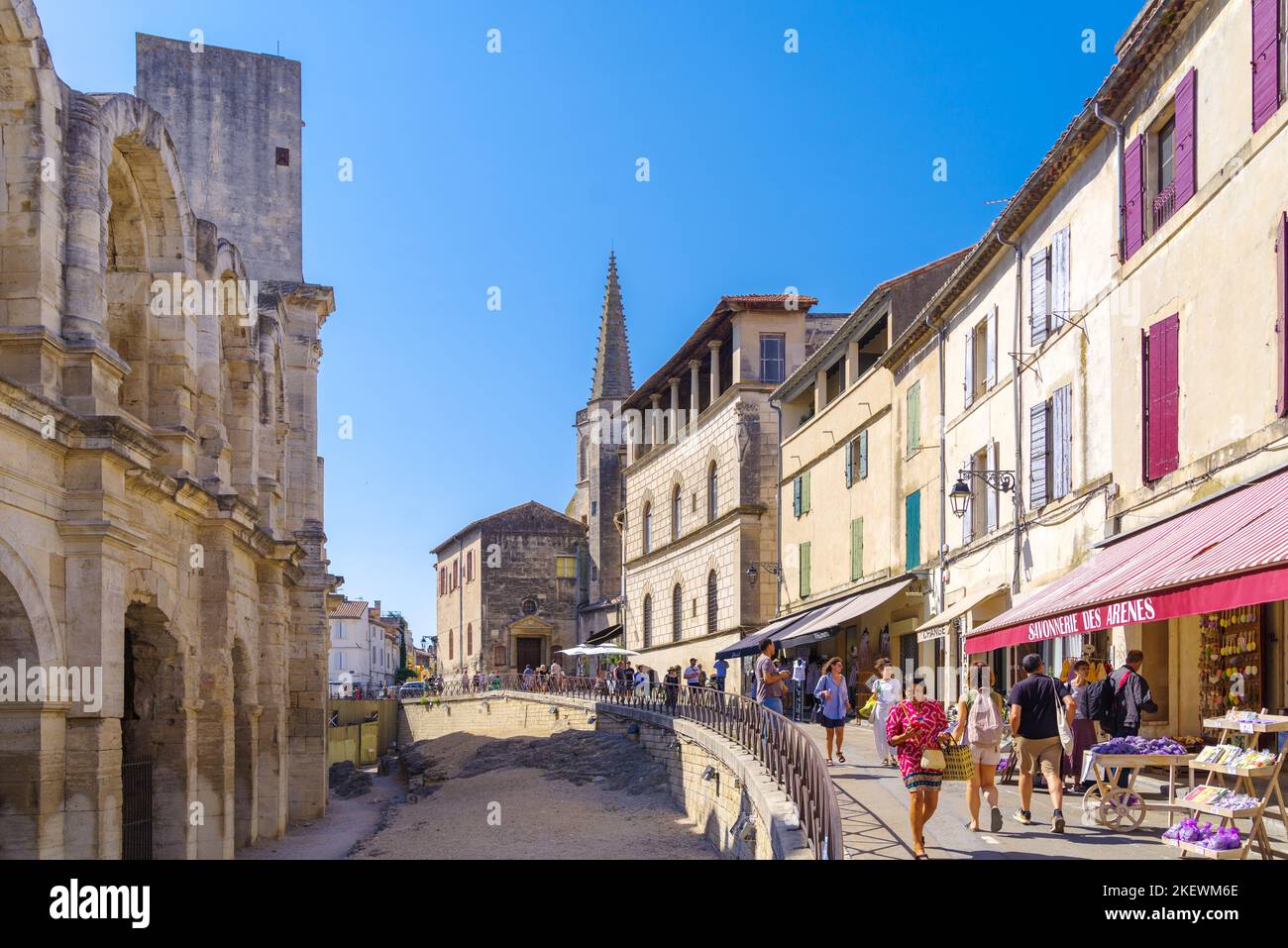 ARLES, FRANCE - AUGUST 6, 2022: Historic city center with the amphitheatre on the left Stock Photo