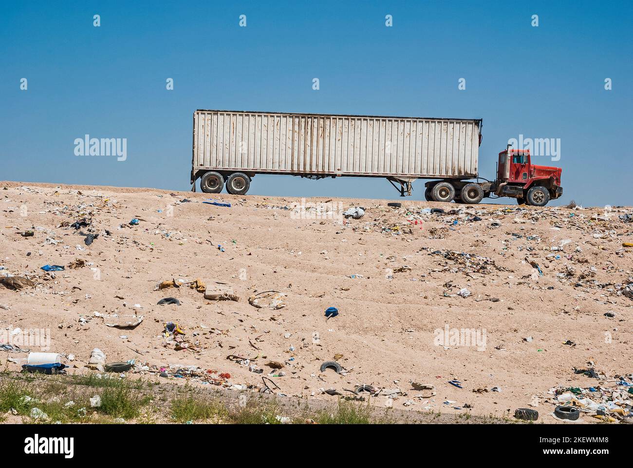 An old, beatup semi tractortrailer rig at an active landfill Stock