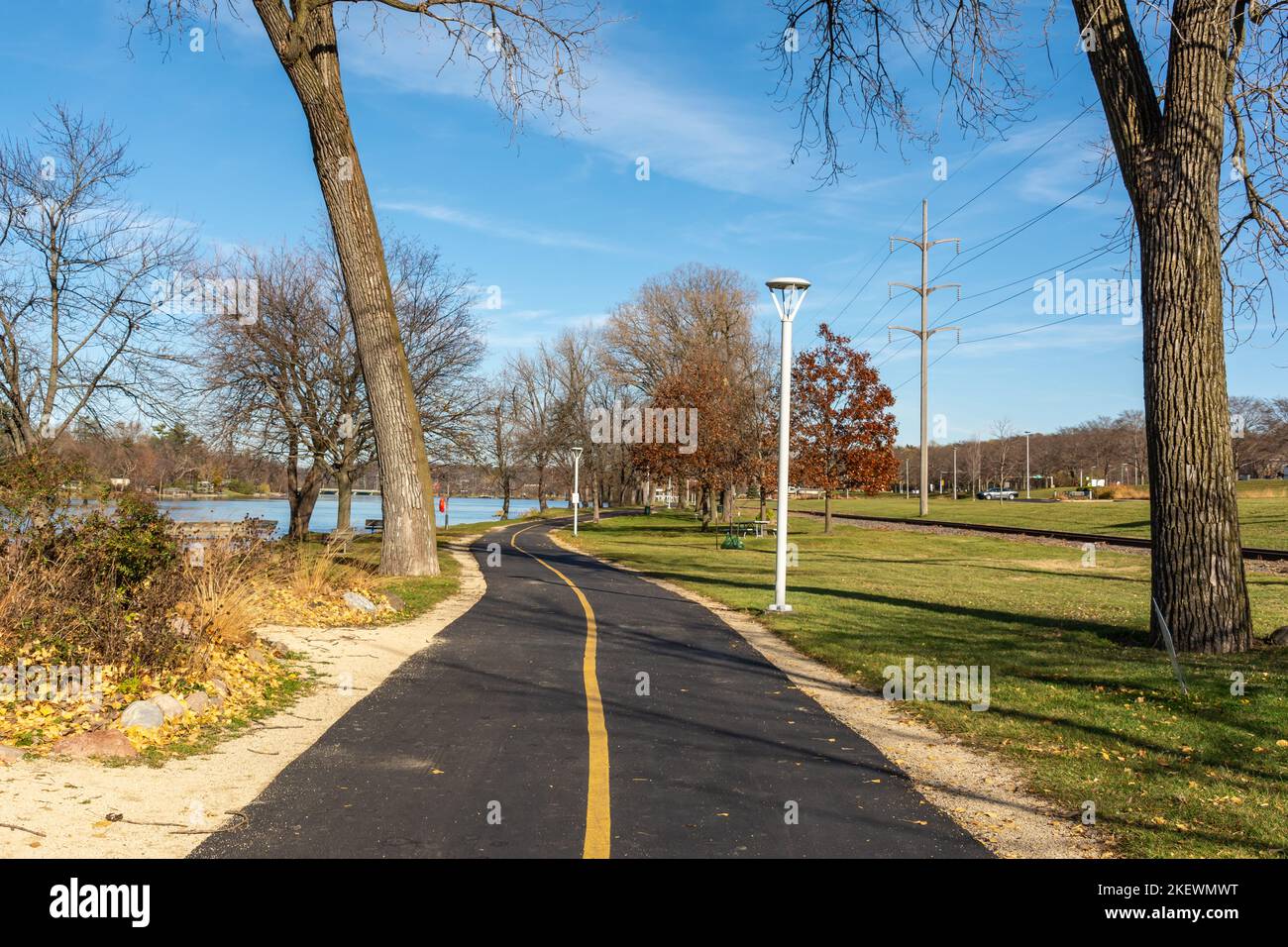 Bike trail and walking path along the rock river on a sunny late fall day.  Rockford, Illinois, USA. Stock Photo