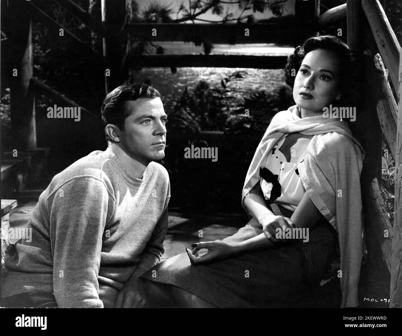 DANA ANDREWS and MERLE OBERON in NIGHT SONG 1947 director JOHN CROMWELL Miss Oberon's gowns Orry-Kelly John Cromwell Productions / RKO Radio Pictures Stock Photo