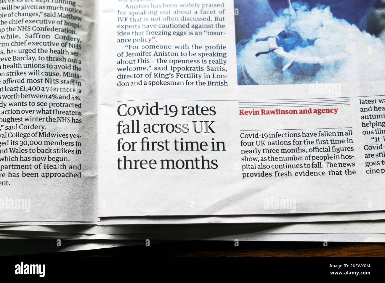 'Covid-19 rates fall across UK for first time in three months' Guardian newspaper headline health clipping virus article 11 November 2022 London UK Stock Photo