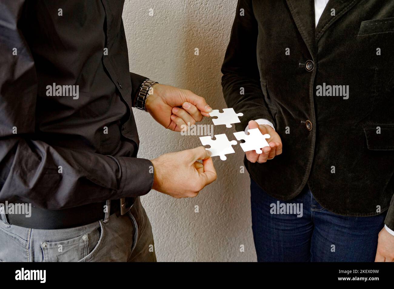 a good collaboration between colleagues or business partners in finding solutions together Stock Photo