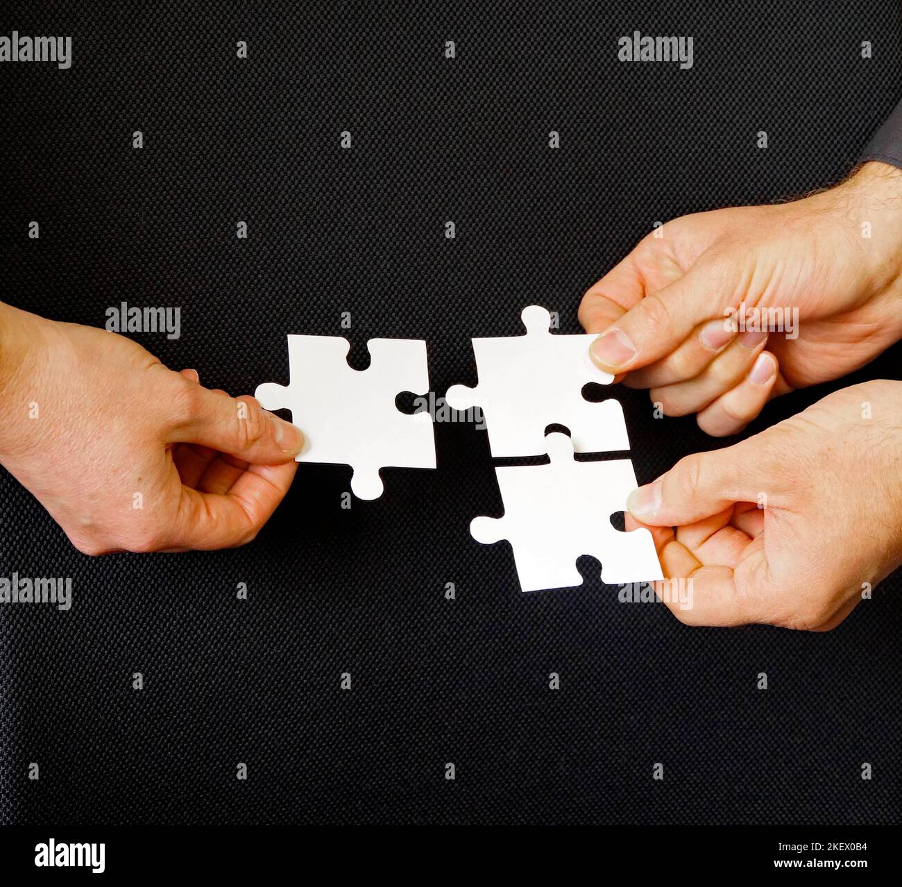 a good collaboration between colleagues or business partners in finding solutions together Stock Photo