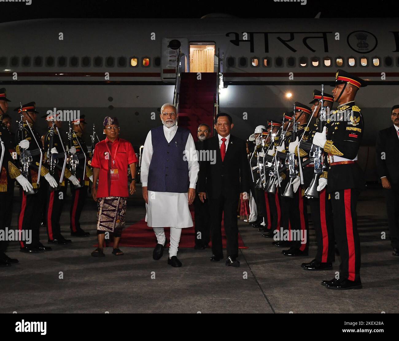 Bali, Indonesia. 14th Nov, 2022. Indian Prime Minister Narendra Modi (C) arrives at Ngurah Rai International airport in Denpasar on the Indonesian resort island of Bali, on Monday, November 14, 2022.The 17th Group of Twenty (G20) Heads of State and Government Summit will be held in Bali from November 15 to 16 2022. Photo by Prime Minister of India Press Office/UPI Credit: UPI/Alamy Live News Stock Photo