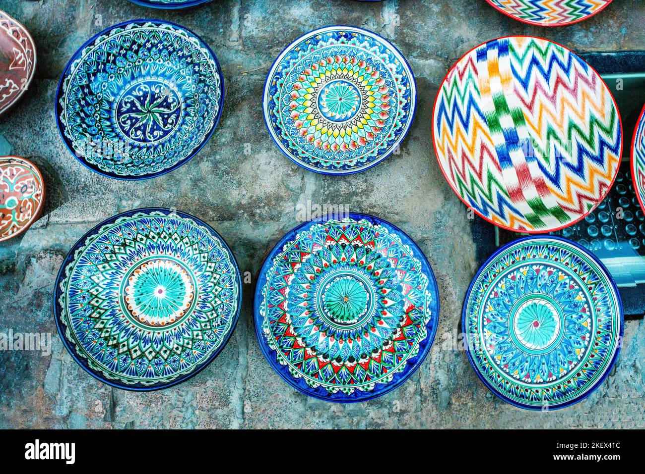 Typical plates in Uzbek style on concrete  floor in Old City Khiva Stock Photo