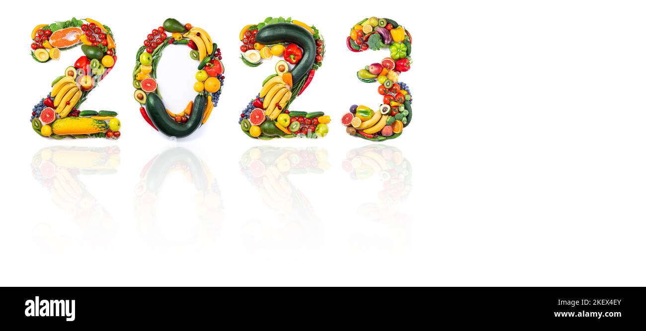 New year resolutions 2023 from healthy food. 2023 made of vegetables, fruits and fish on white background. New year 2023 food trends. 2023 resolutions Stock Photo