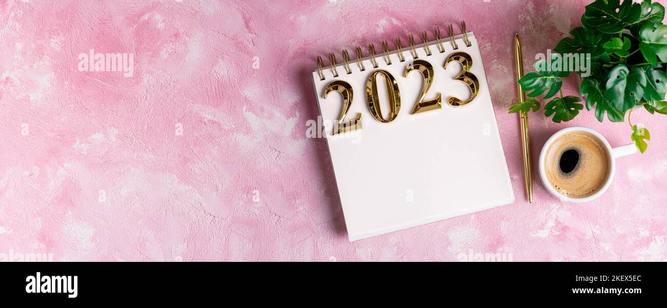 New year resolutions 2023 on desk. 2023 resolutions list with notebook