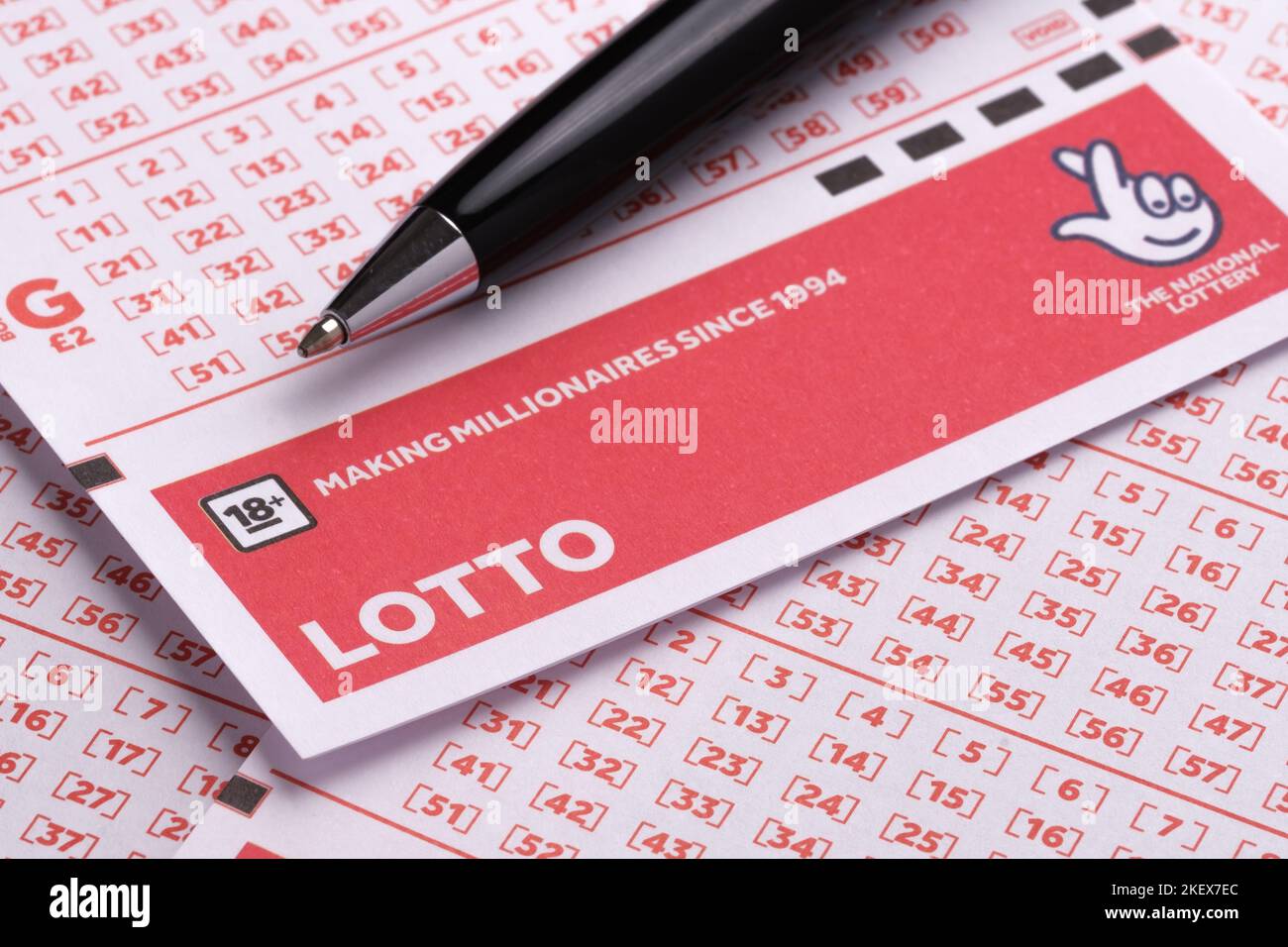 LOTTO blank lottery tickets and the black pen placed on top. UK National Lottery. Selective focus. Stafford, United Kingdom, November 14, 2022 Stock Photo