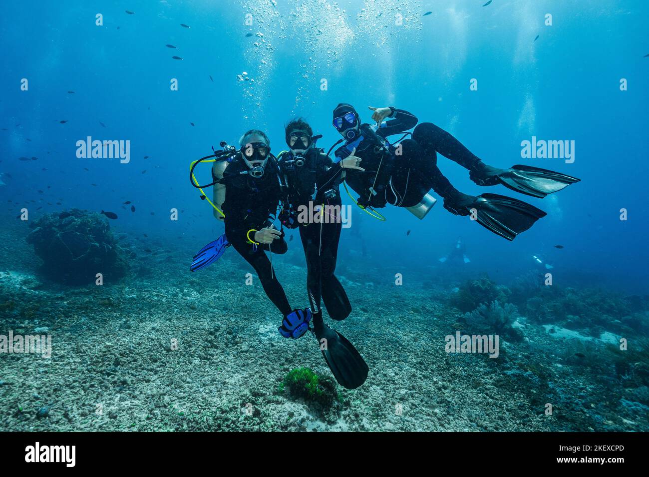 diving buddies posing underwater close to Flores Island in Komodo Stock